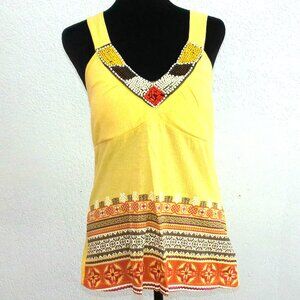 Yellow V-neck orange floral pattern tank top, with cross back and beads details
